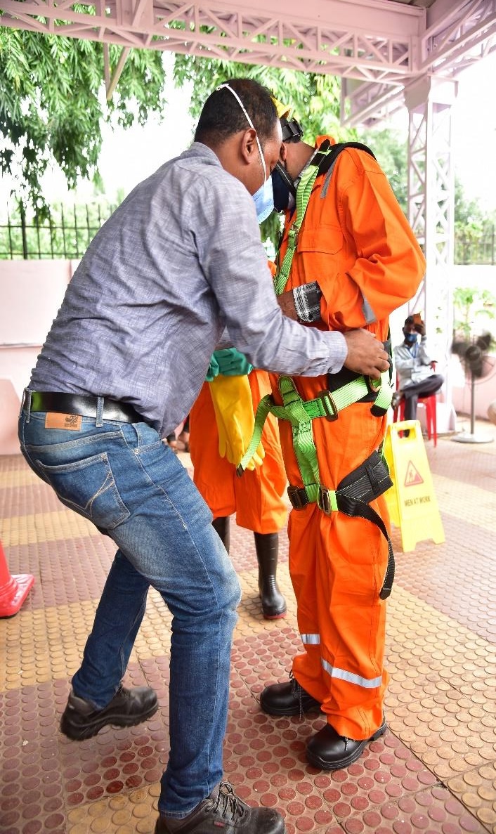 Sanitation Worker getting suited